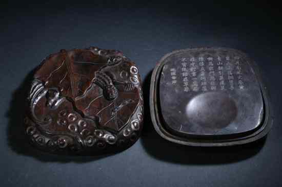 Appraisal: CHINESE INKSTONE AND ROSEWOOD BOX The cover carved with dragon