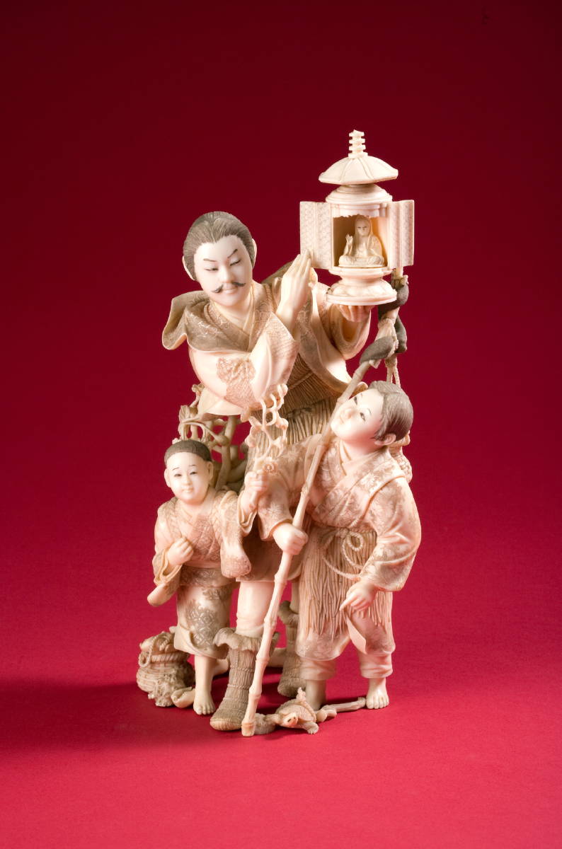 Appraisal: JAPANESE CARVED IVORY FAMILY SCENE WITH A SHRINE MEIJI PERIOD