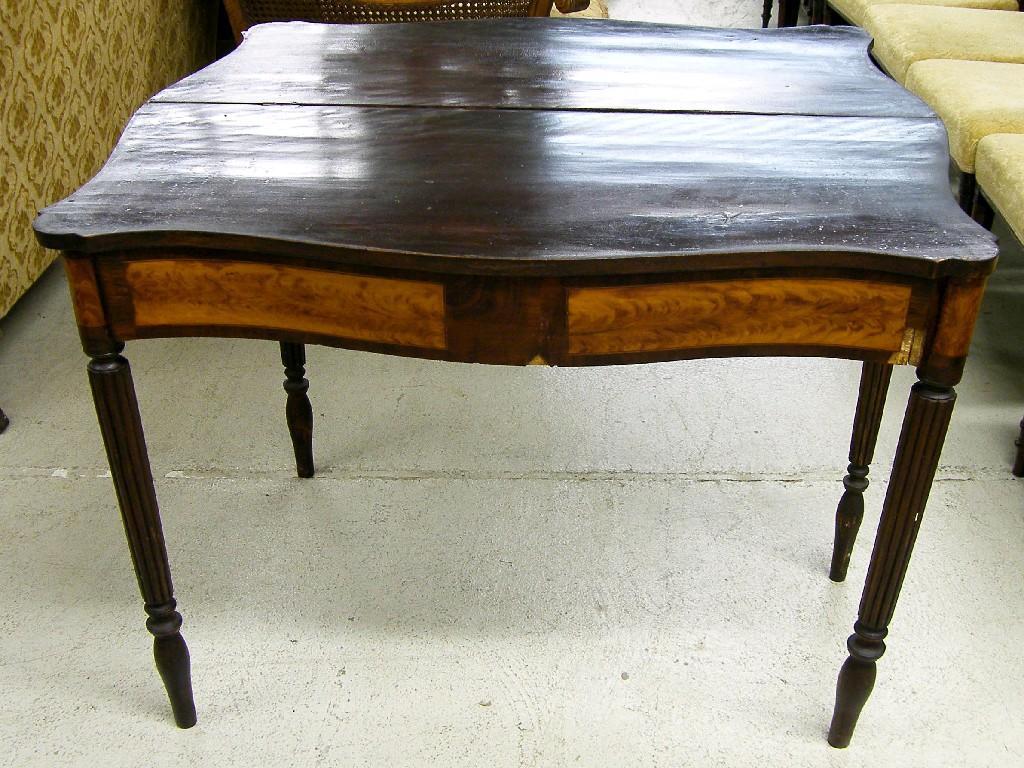 Appraisal: Stained mahogany and satinwood serpentine fold-over tea table supported upon