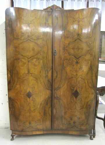 Appraisal: BURL WALNUT WARDROBE English mid- th century having a full