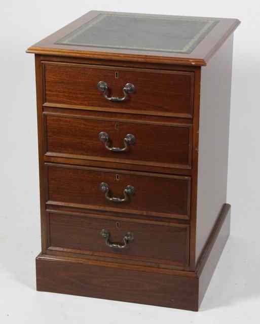 Appraisal: A reproduction mahogany two-drawer filing cabinet the inset leather panel