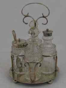 Appraisal: A four bottle silver plated cruet