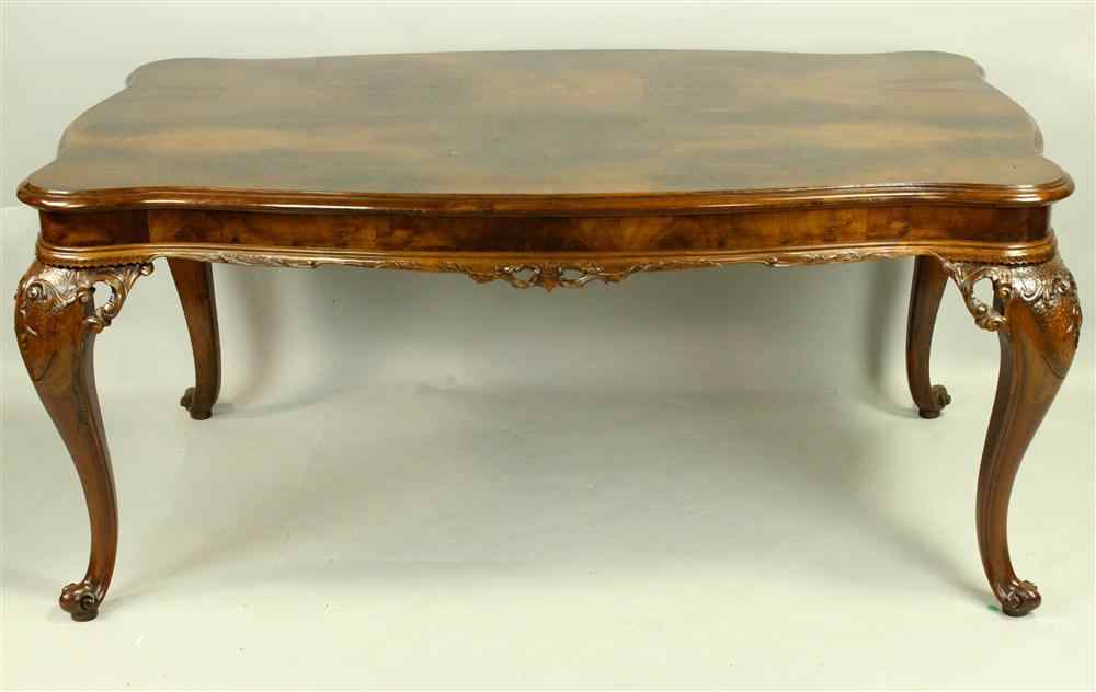 Appraisal: ITALIAN ROCOCO STYLE CARVED WALNUT DINING TABLE having a rectangular