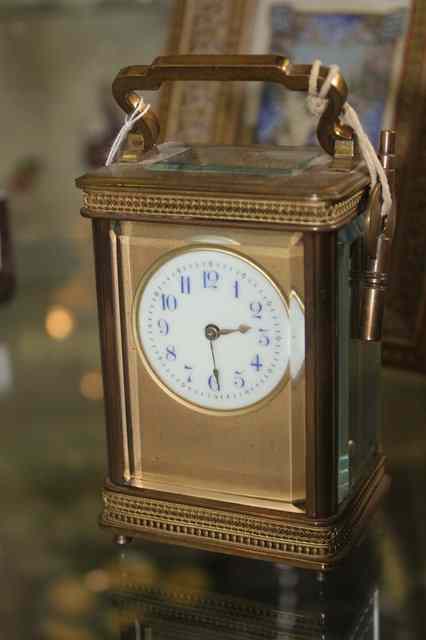 Appraisal: A TH CENTURY FRENCH BRASS CARRIAGE CLOCK with loop handle