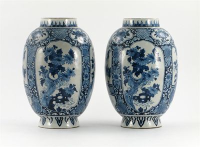 Appraisal: A pair of Dutch Delft blue and white vases painted