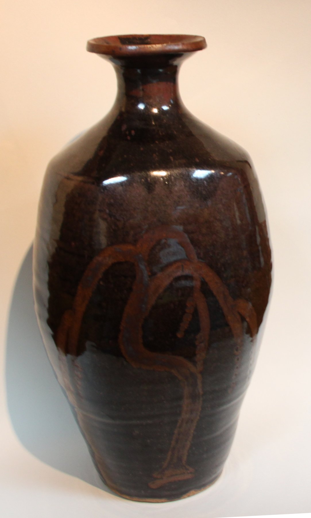 Appraisal: David Leach A fine brown glazed bottle vase decorated with