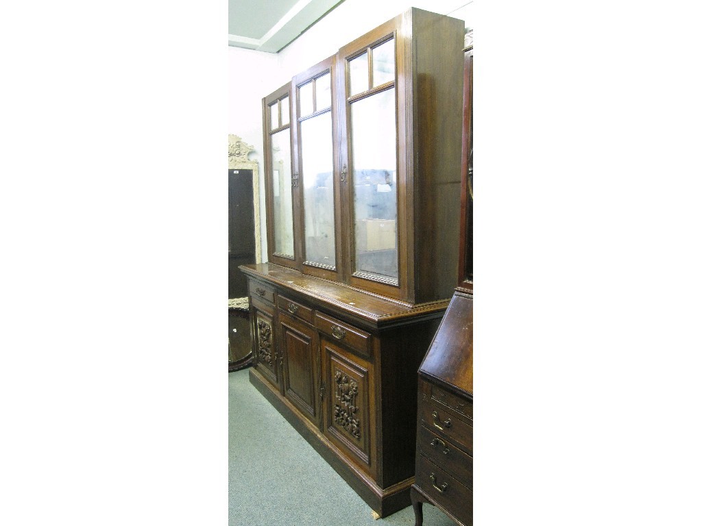 Appraisal: Victorian oak three door bookcase on cabinet no cornice