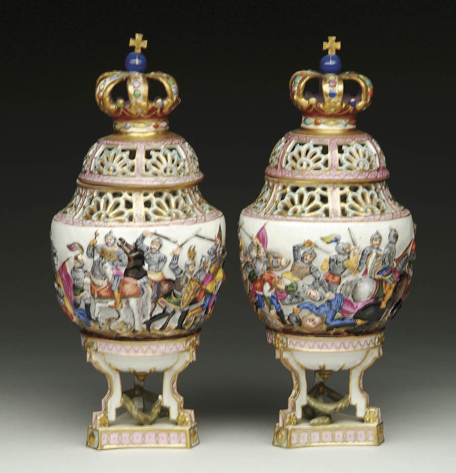 Appraisal: PAIR OF CAPO DI MONTE TYPE COVERED URNS Vase shaped