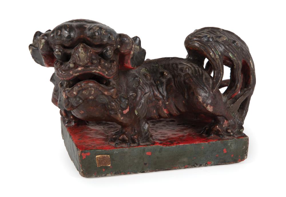 Appraisal: Chinese Painted Stone Buddhist Lion modeled crouching on plinth partial