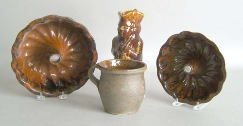 Appraisal: Two turk's head molds together with a redware mug and