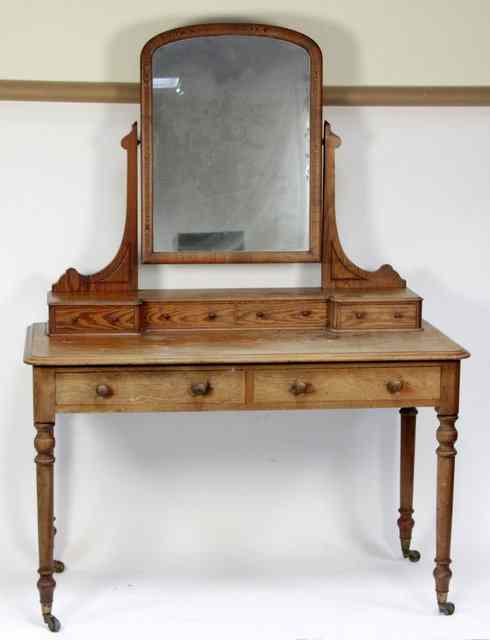 Appraisal: A pine mirror-back dressing table the superstructure with four short