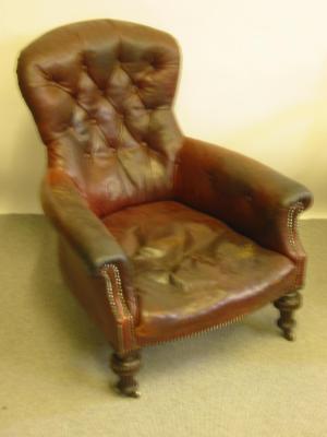 Appraisal: A VICTORIAN WALNUT FRAMED CLUB ARMCHAIR of spoon back form