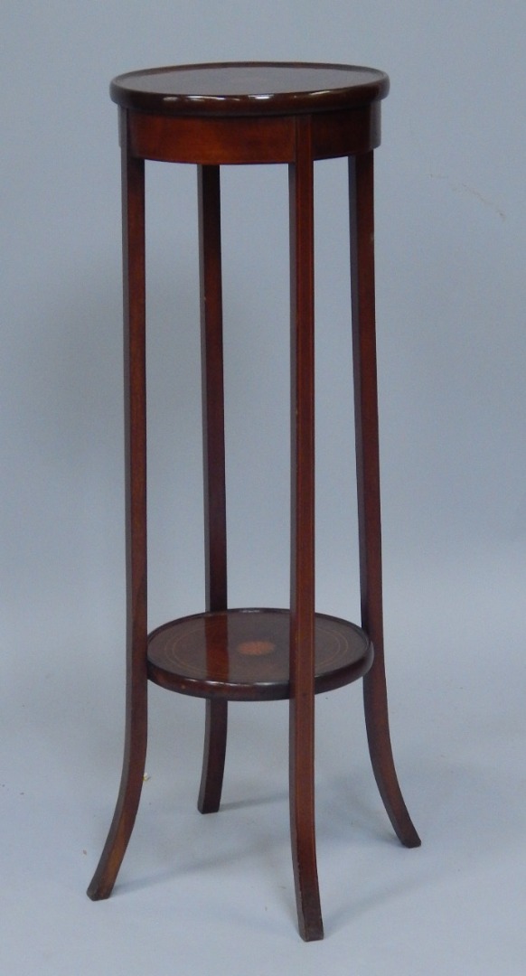 Appraisal: An Edwardian mahogany and marquetry two tier plant stand with