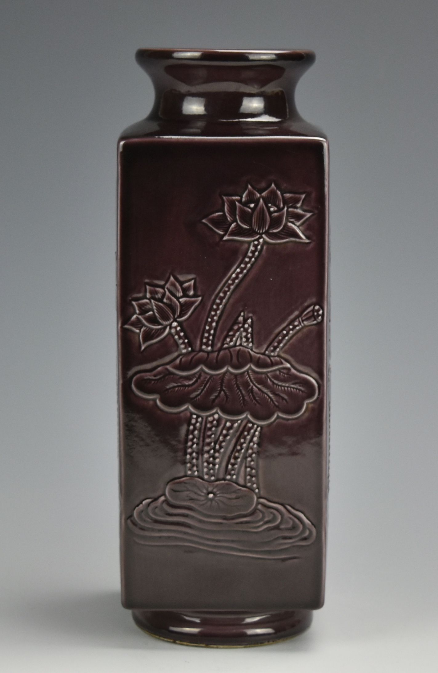 Appraisal: A square-sided dark purple Chinese porcelain vase with a trumpet