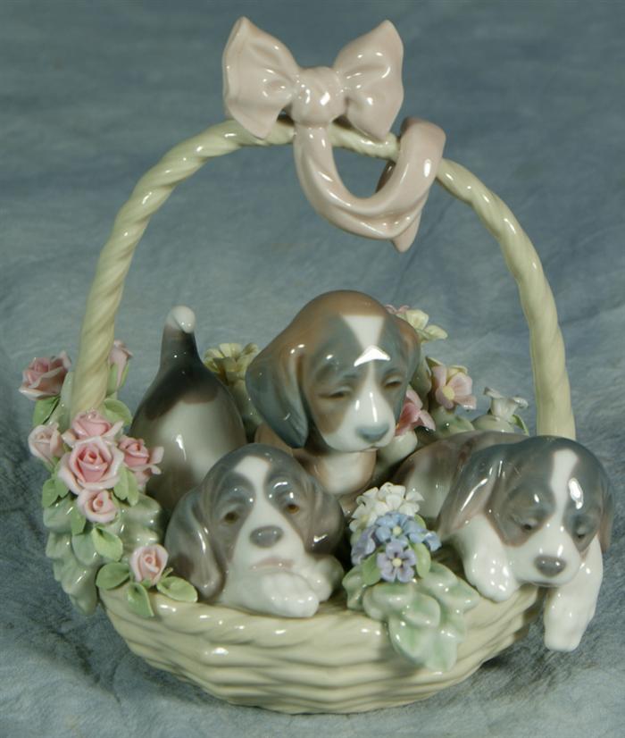 Appraisal: Lladro figurine three puppies in a basket one white flower