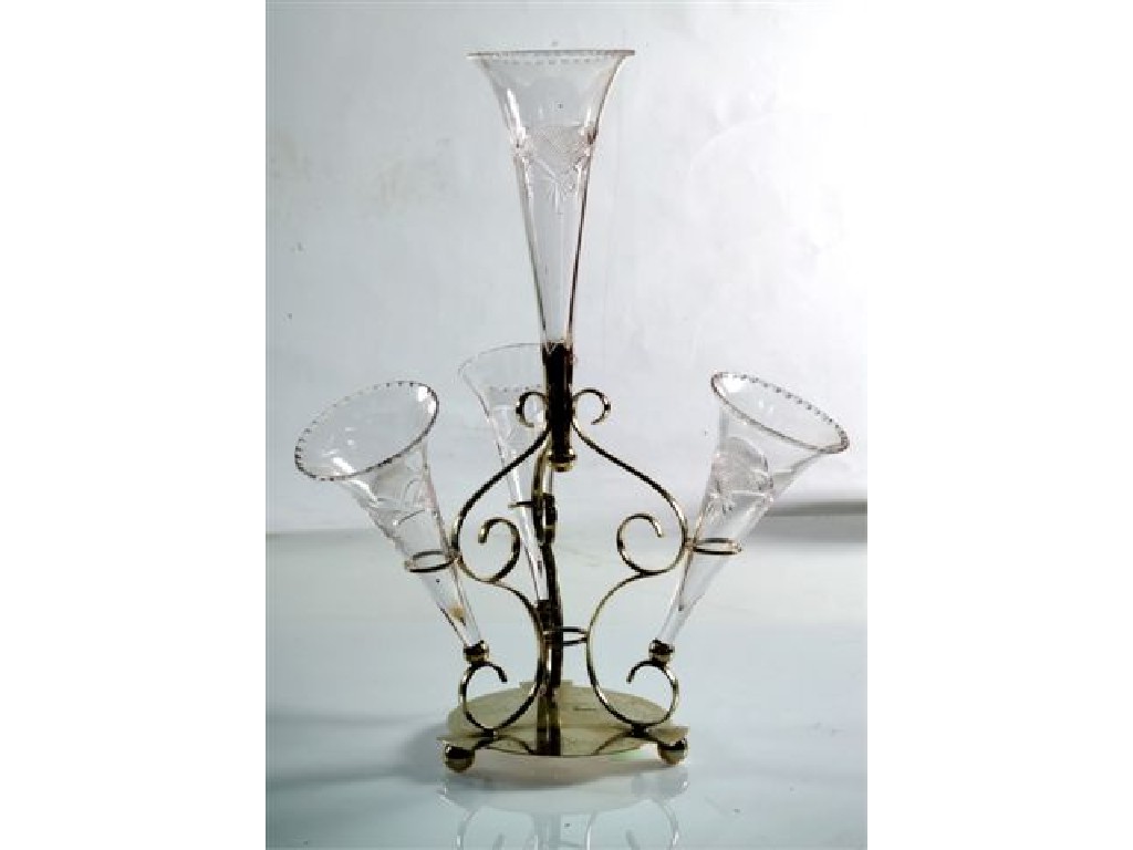 Appraisal: EDWARDIAN SILVER-PLATE AND CUT-GLASS EPERGNE the etched scrollwork stand issuing