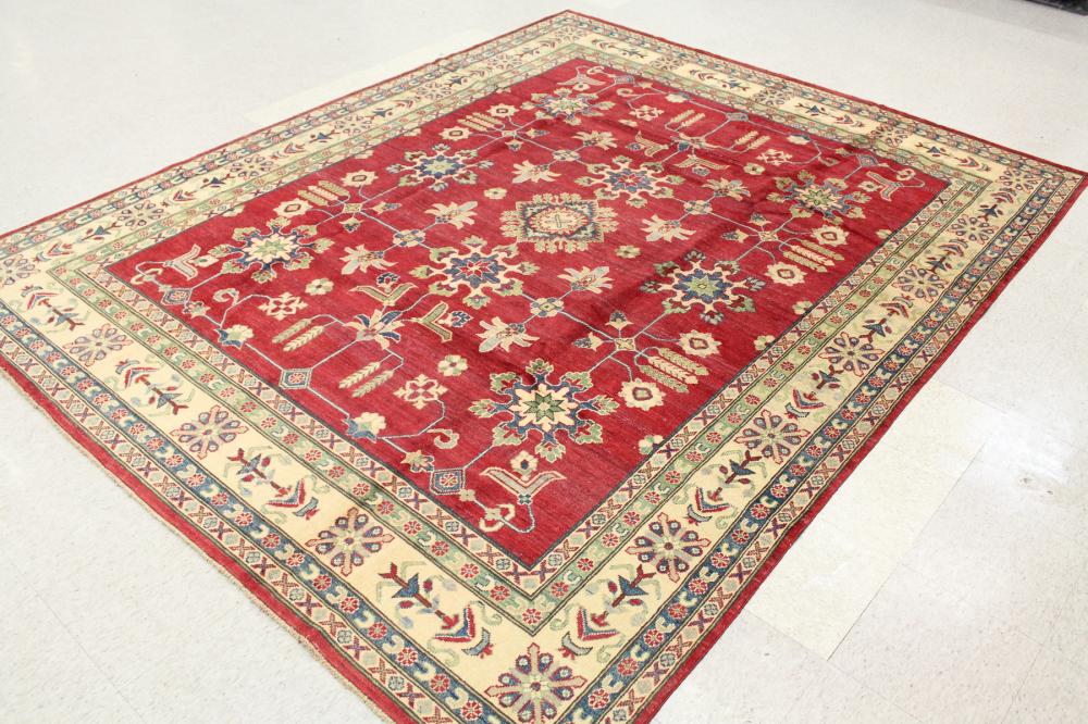 Appraisal: HAND KNOTTED ORIENTAL CARPET Pakistani Persian stylized floral design on