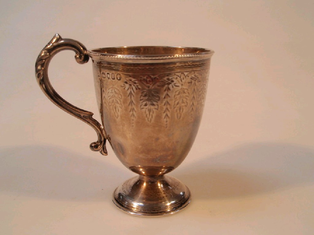 Appraisal: A Victorian silver christening mug of tapered oval form with