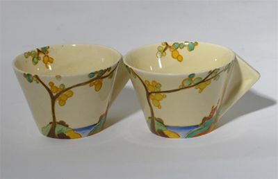 Appraisal: Secrets' a pair of Clarice Cliff Conical cups painted in