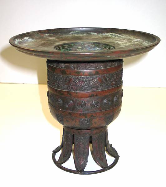 Appraisal: A two-section circular bronze usabata patina worn height in