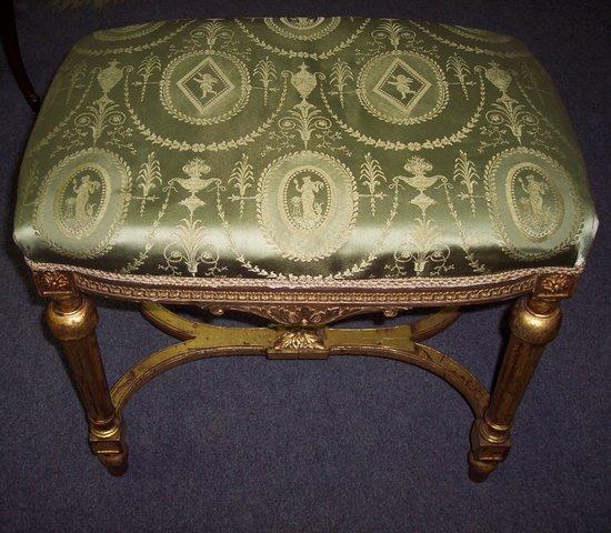 Appraisal: A carved giltwood stool the upholstered seat on fluted taper