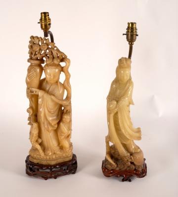 Appraisal: A Chinese soapstone figure of Guanyin pouring a vase of