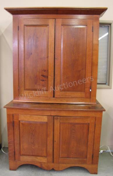 Appraisal: An antique stepback cupboard walnut raised panel blind doors pc