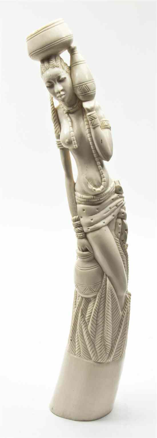 Appraisal: An African Carved Ivory Tusk depicting a stylized woman laden