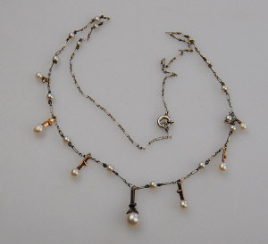 Appraisal: Edwardian silver and pearl fringe necklace with small diamond highlights