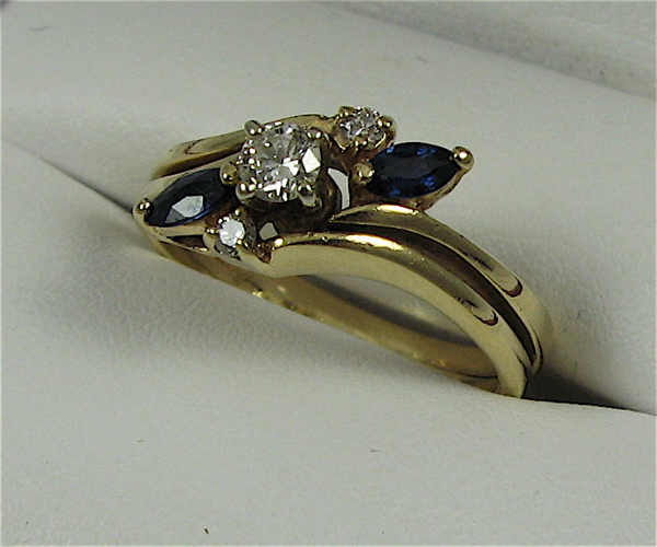 Appraisal: SAPPHIRE DIAMOND AND K GOLD RING set with two marquise-cut