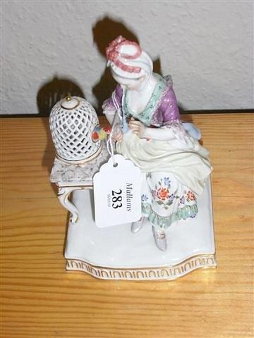 Appraisal: A MEISSEN MODEL of a girl and a bird in