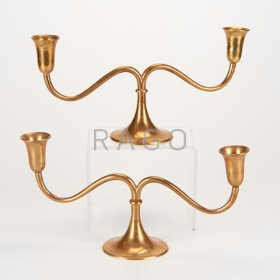 Appraisal: STYLE OF FRANZ HAGENAUER Pair of brass candelabra Austria early-