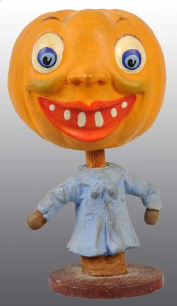 Appraisal: German Halloween Pumpkin Man Nodder Description Painted composition Figure with