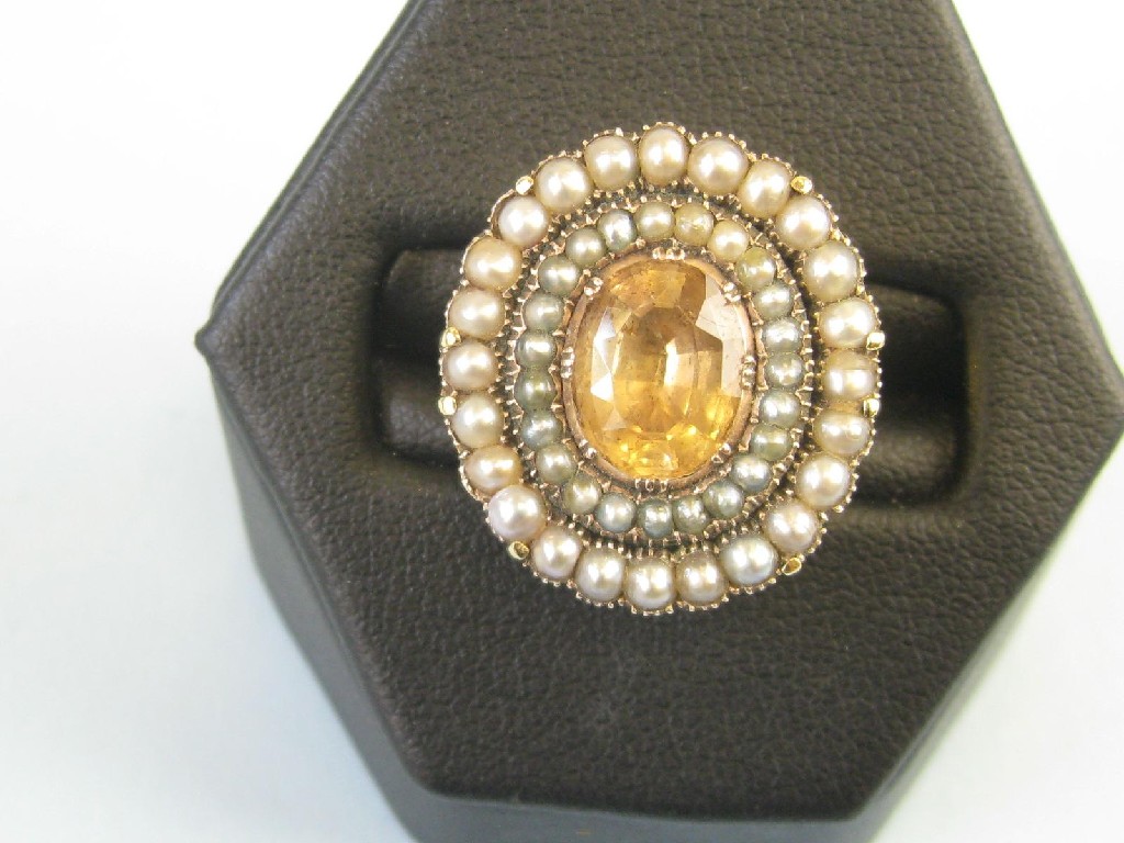 Appraisal: A Citrine and seed pearl Ring the central oval-shaped citrine