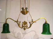 Appraisal: A two arm brass pendant light fitting with rise and