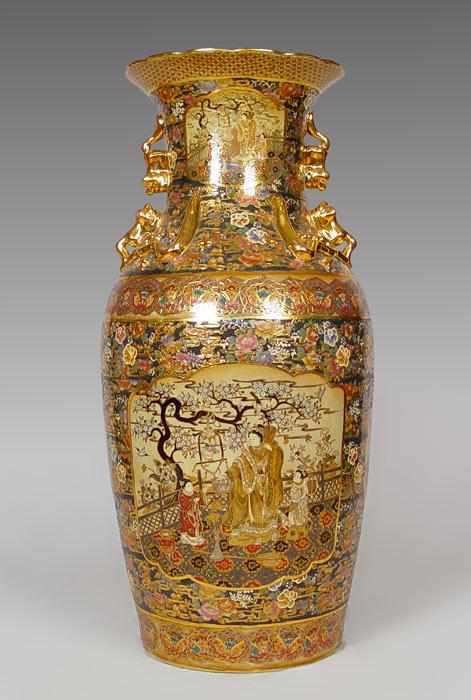 Appraisal: CHINESE PALACE VASE Foo dog handles rich in gold embellishments