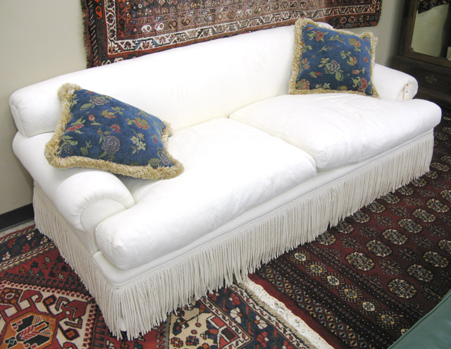 Appraisal: A CONTEMPORARY SOFA with overall brocade ivory upholstery and braided