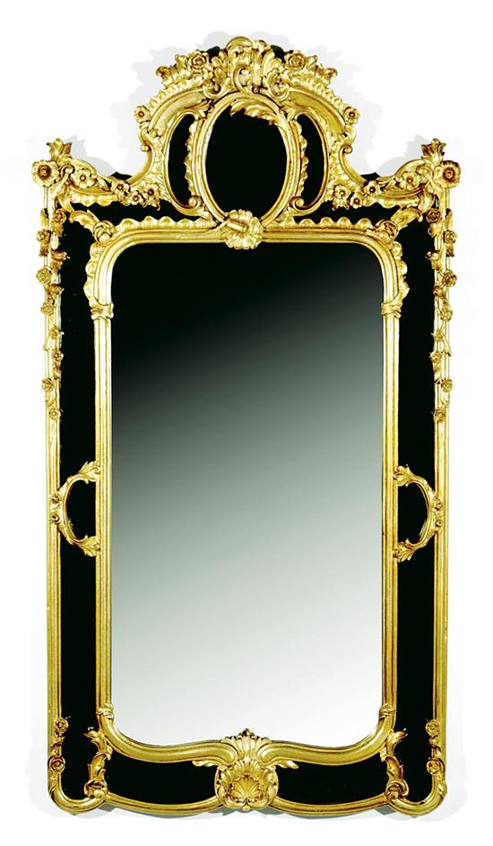 Appraisal: Carved giltwood and smoked glass mirror floral and C-scroll cartouche