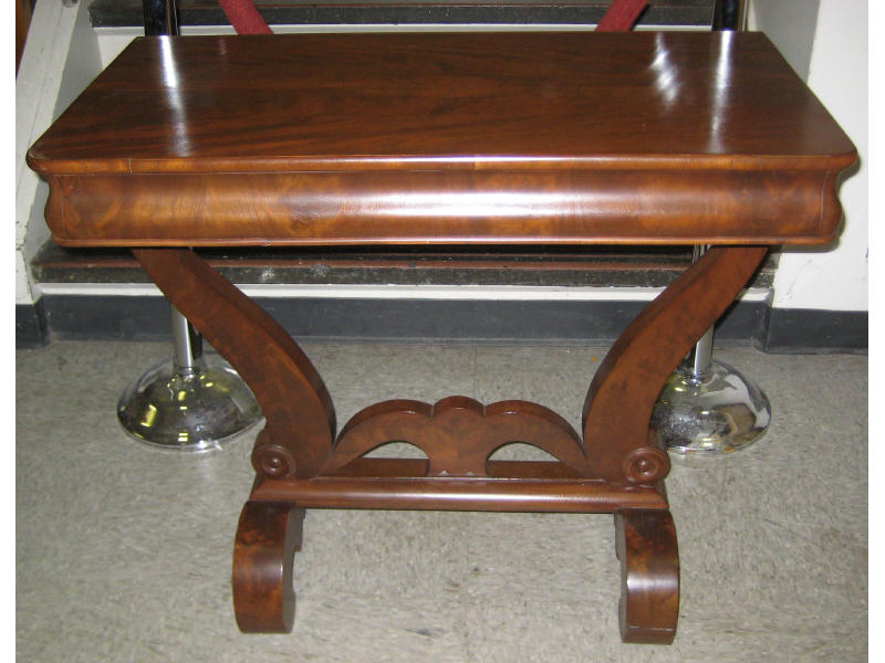 Appraisal: AMERICAN CLASSICAL REVIVAL MAHOGANY CONSOLE TABLE Rectangular top with rounded