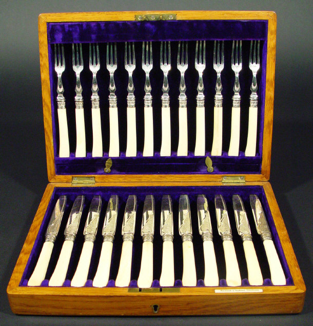 Appraisal: Set of twelve silver collared dessert knives and forks with