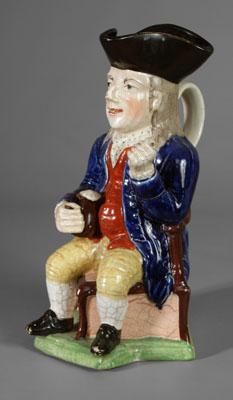 Appraisal: Pearlware Toby jug gentleman in blue coat and orange vest