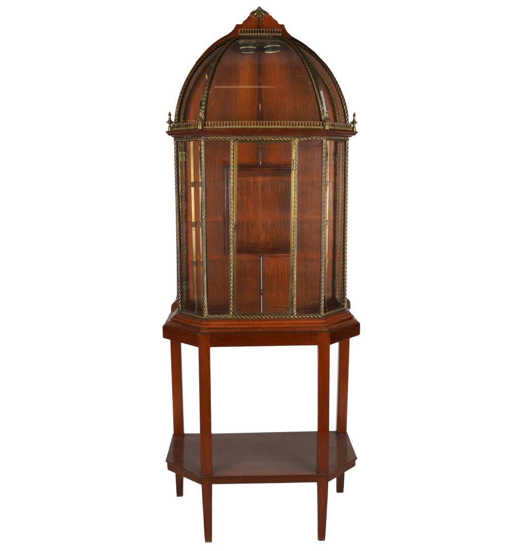 Appraisal: BRASS-MOUNTED MAHOGANY VITRINEafter with illuminated interior and rear door Provenance