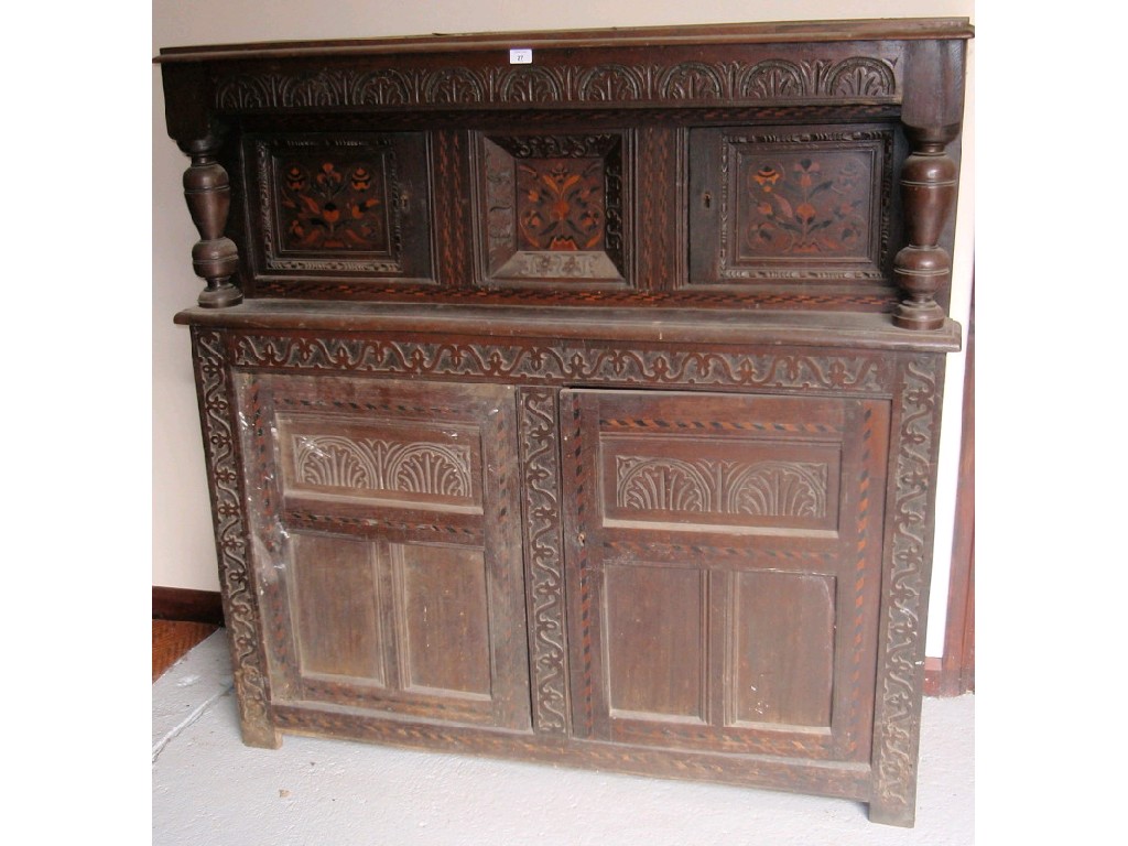 Appraisal: A thC and later oak court cupboard with chevron banding