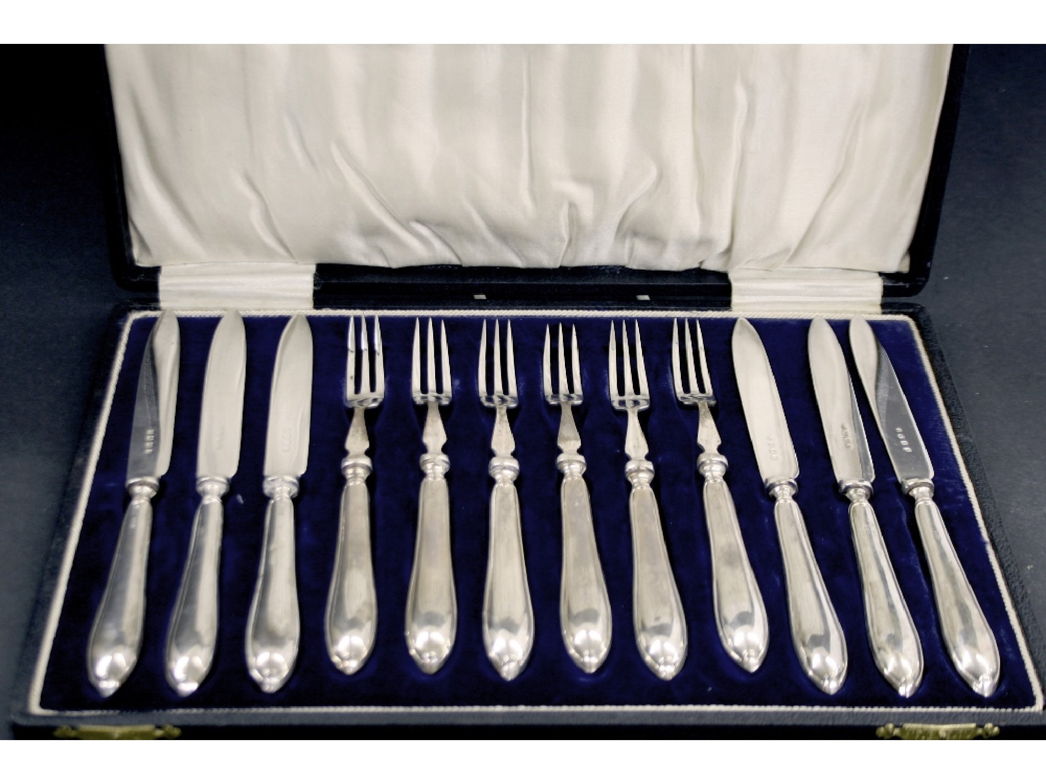 Appraisal: Canteen of six silver handled fruit knives and forks maker