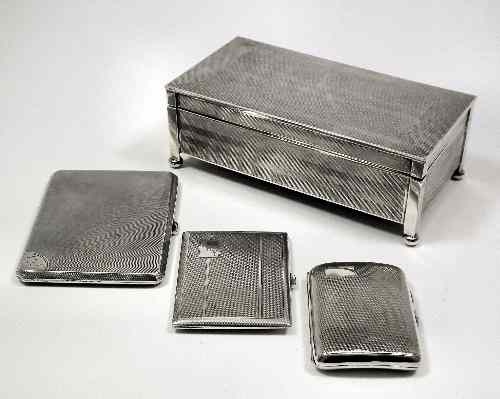 Appraisal: A George V silver rectangular cigarette box with engine turned