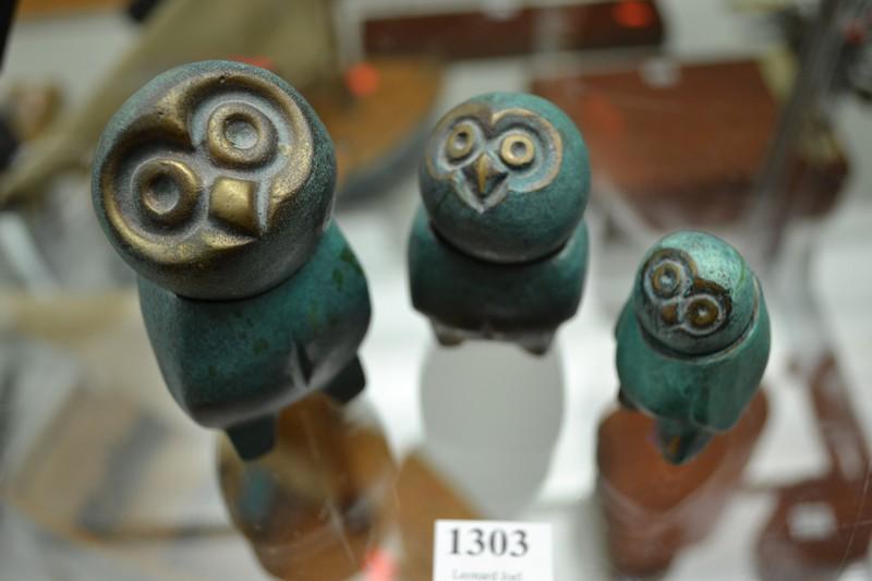 Appraisal: THREE BRONZE OWLS WITH REVOLVING HEADS