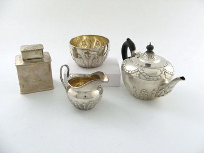 Appraisal: A three-piece Victorian silver bachelor's tea set circular tapering form