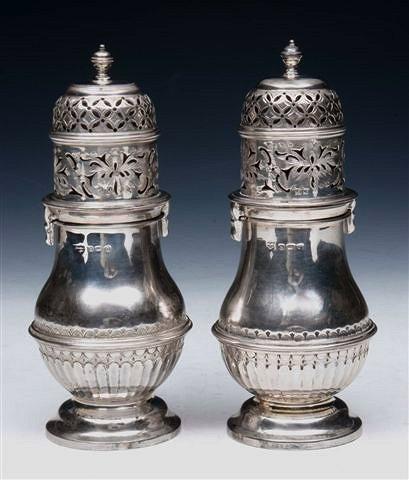 Appraisal: A MATCHED PAIR OF SILVER CASTORS fluted lower body on