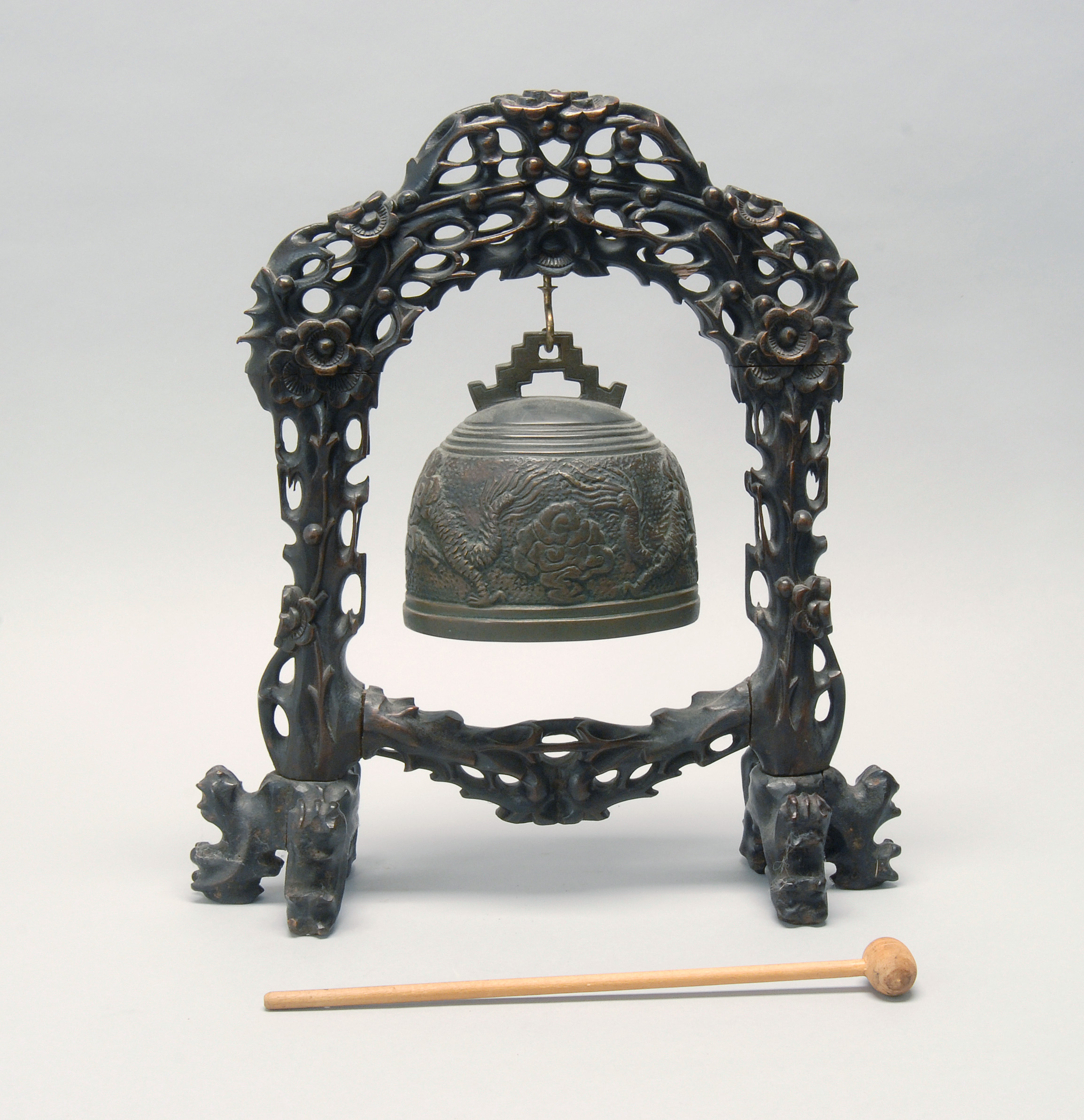 Appraisal: BRONZE BELL ON WOOD STAND Late th CenturyBell with dragon