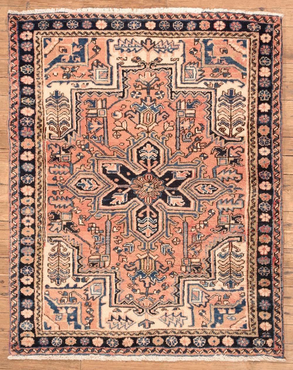 Appraisal: Persian Heriz Carpet red and cream ground blue border central